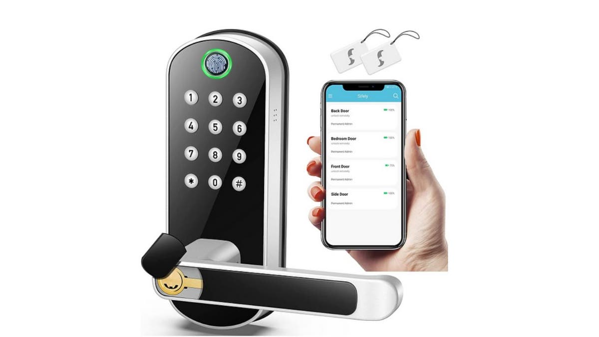 Door handle with keypad and hand holding phone