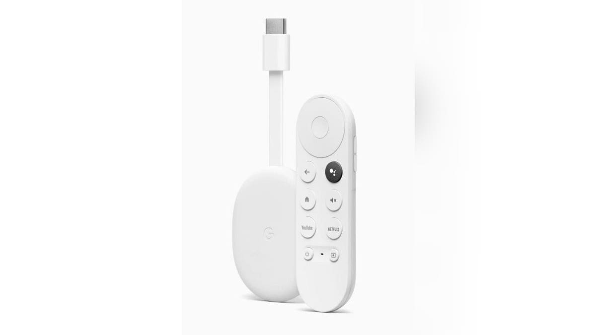 White Google Chromecast streaming device and the remote.