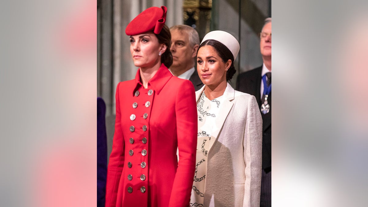 Kate Middleton and Meghan Markle at a royal engagement looking serious