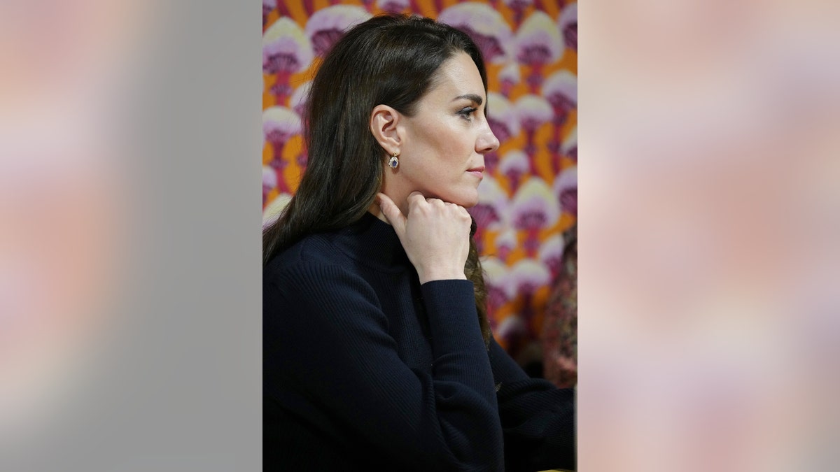 Kate Middleton listening attentively during a royal engagement
