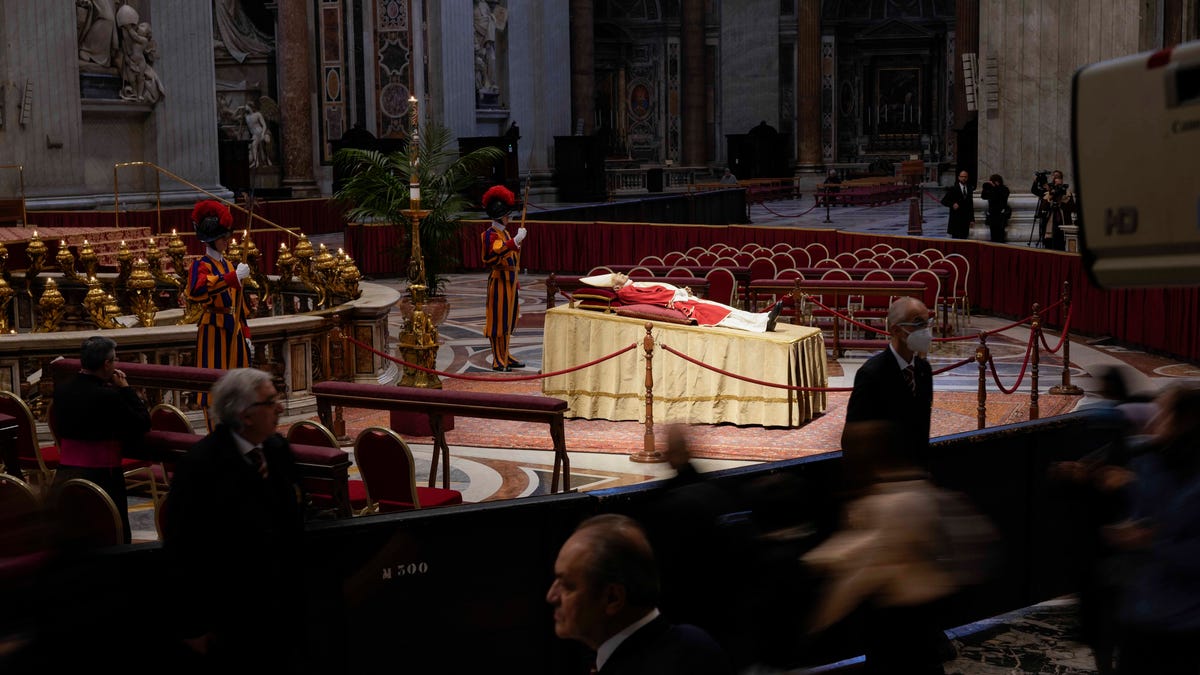 People view the body of late Pope Emeritus Benedict