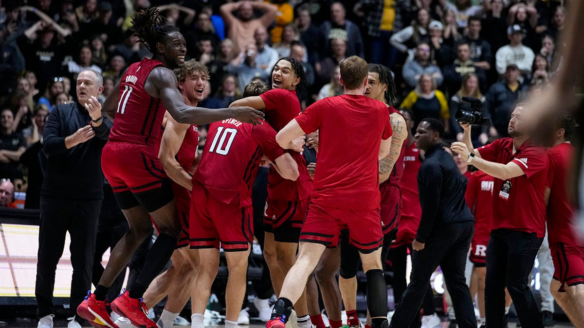 Rutgers players celebrate after beating Purdue