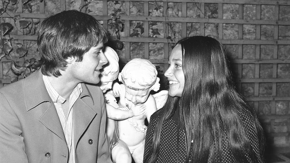 Olivia Hussey and Leonard Whiting looking at each other