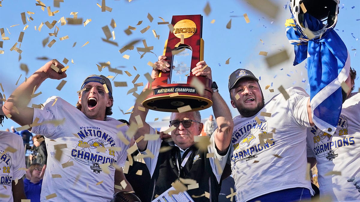 John Stiegelmeier celebrates a national championship