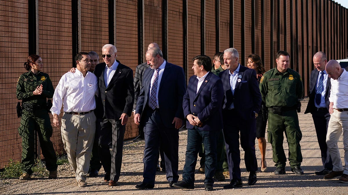 Biden border visit with U.S. Rep. Henry Cuellar along a border fence in Texas