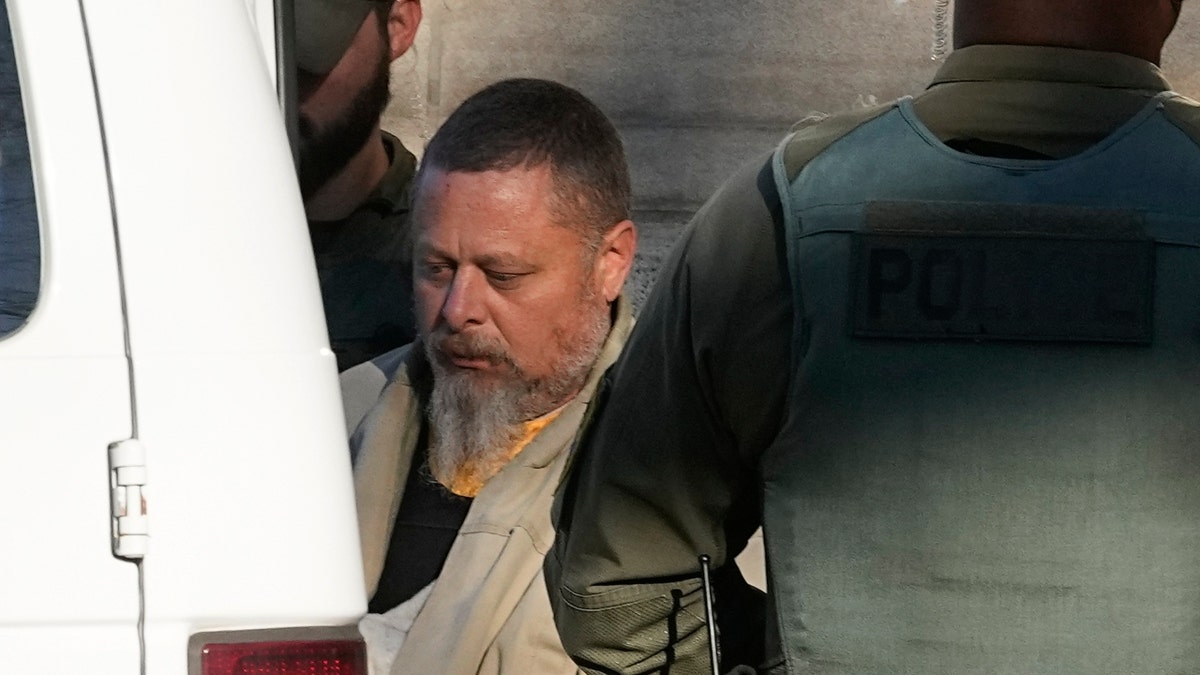 Officers escort Richard Matthew Allen, out of the Carroll County courthouse following a hearing, Tuesday, Nov. 22, 2022, in Delphi, Indiana