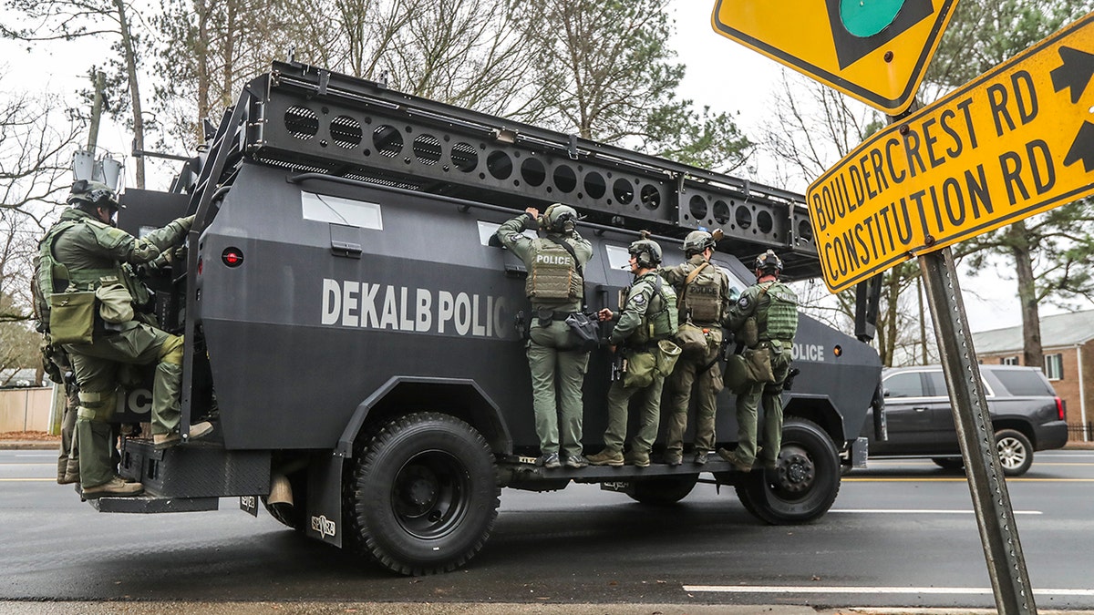 Police and a heavy vehicle