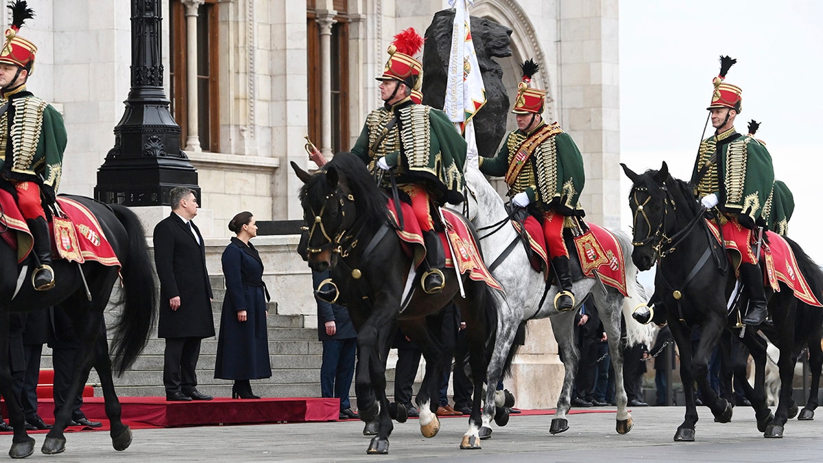 Hungarian officers in uniform on horses