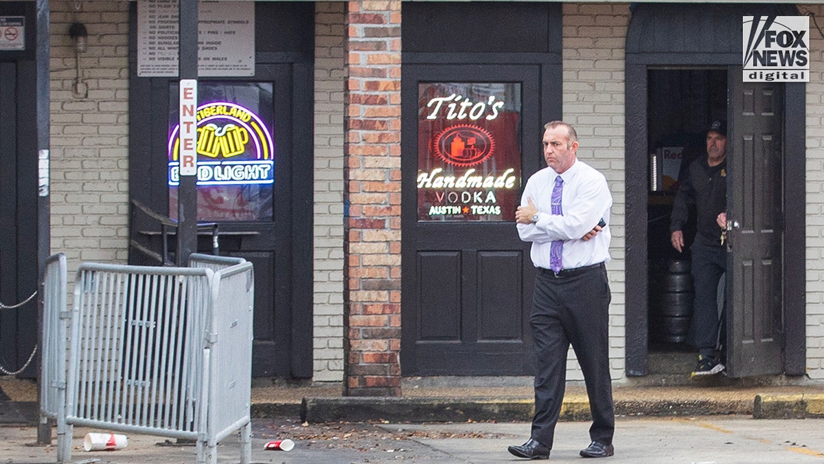 Two men seen standing outside a local bar.