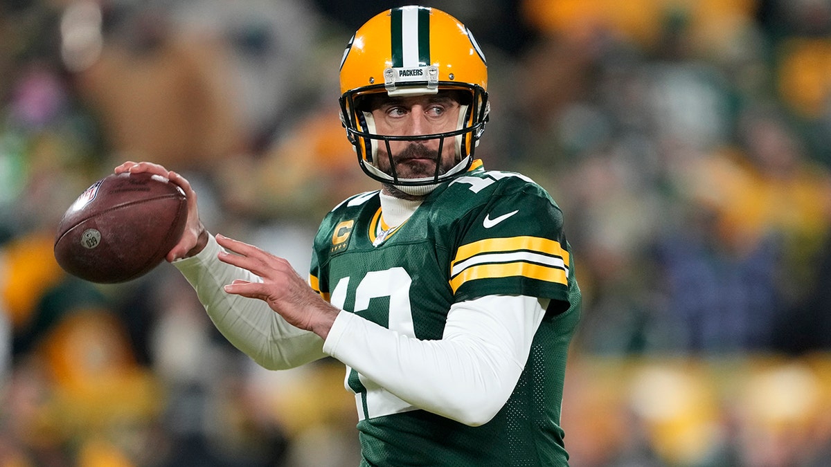 Aaron Rodgers looks to throw