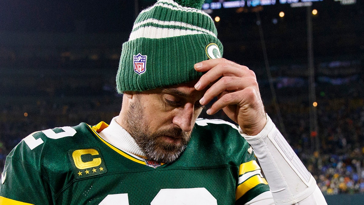 Aaron Rodgers scratches his head