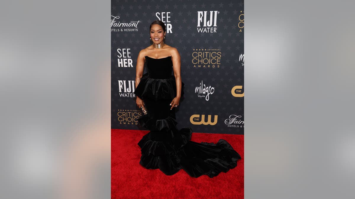 Black Panther star Angela Bassett wears black gown