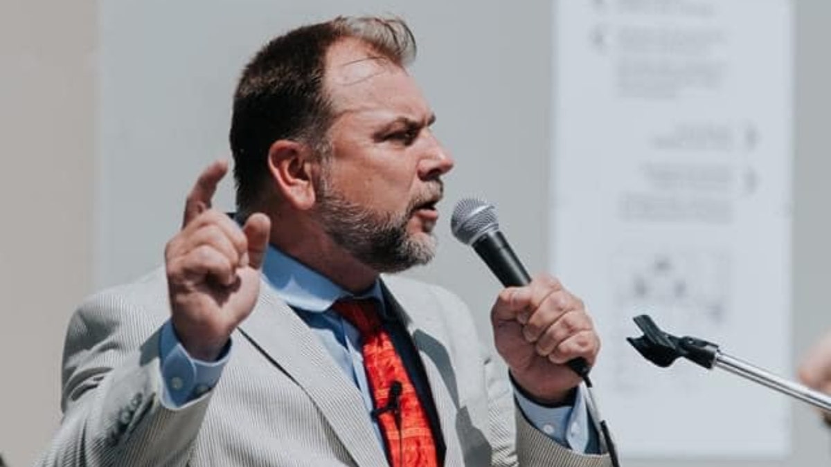 Pastor Artur Pawlowski with microphone