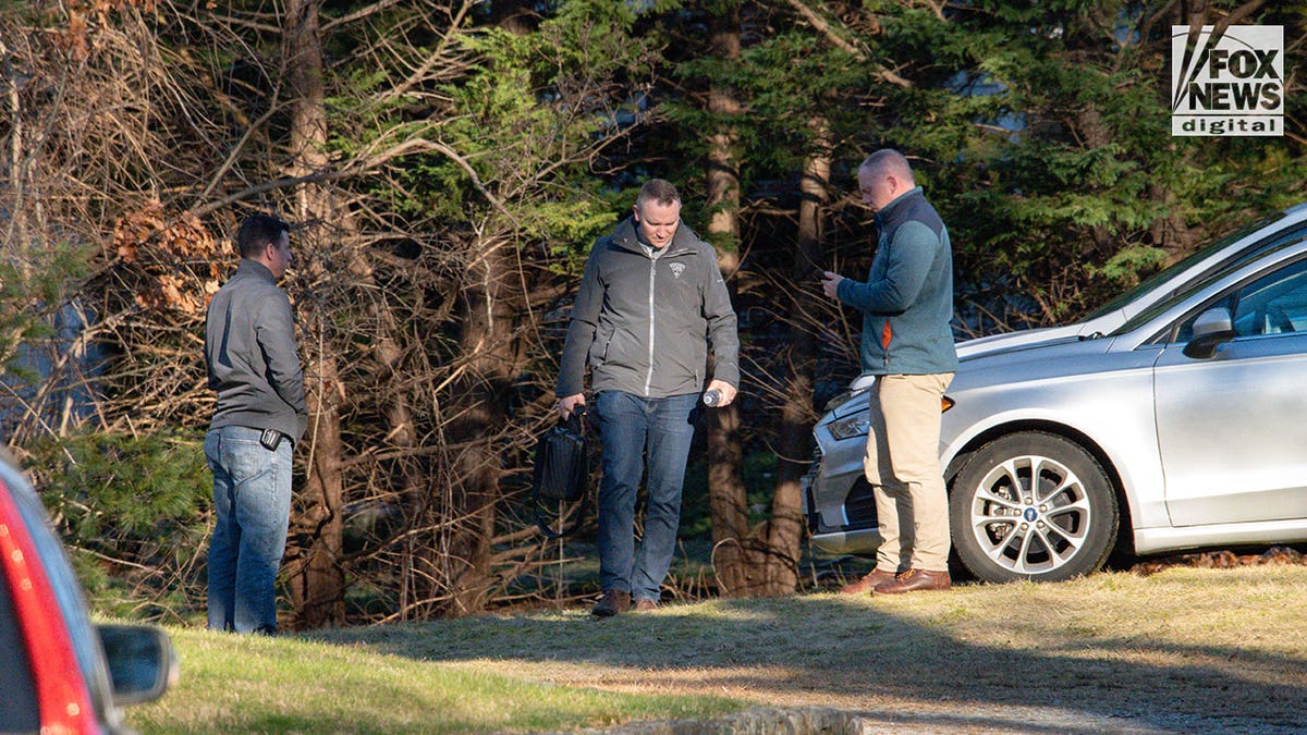 Police/investigators outside Walshe home