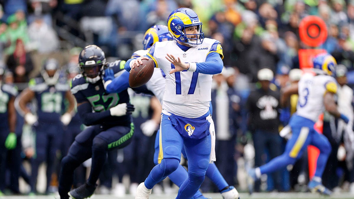 Baker Mayfield throws a pass during the second half of a game