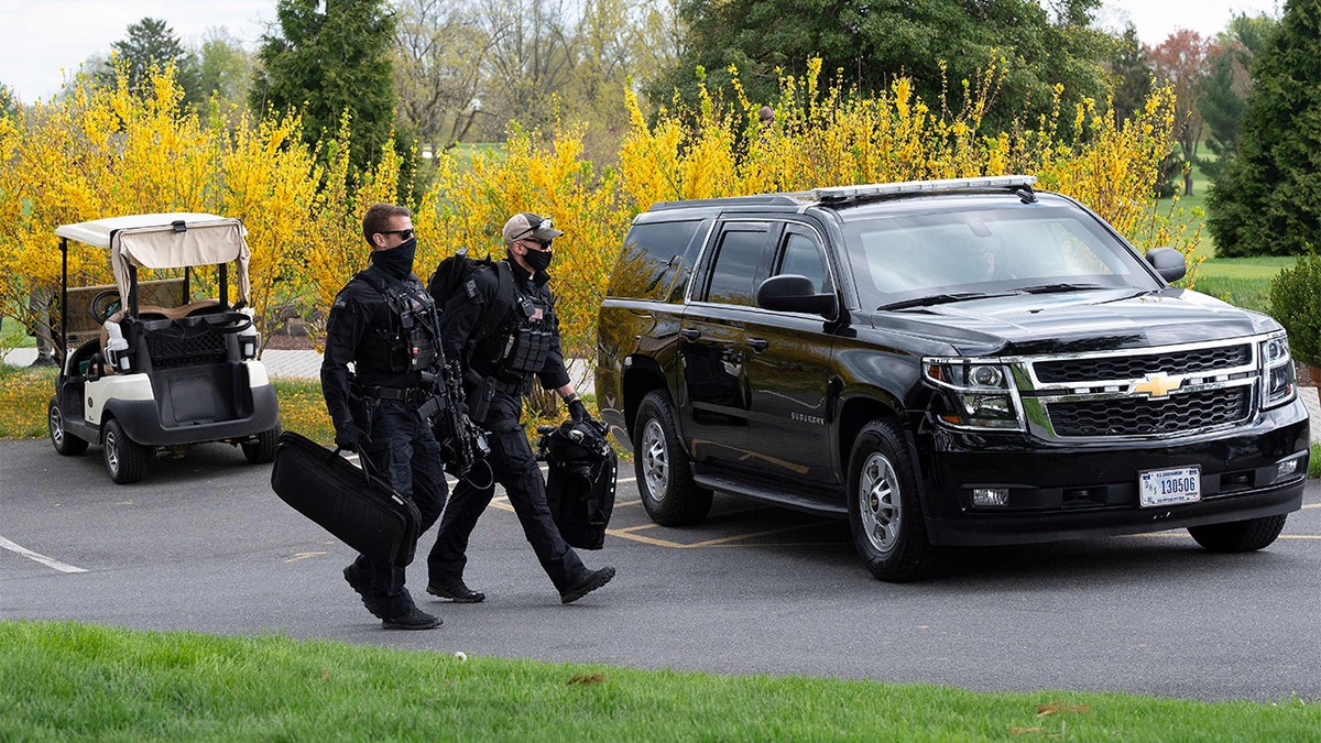 Secret Service agents protect President Biden as he golfs in Delaware