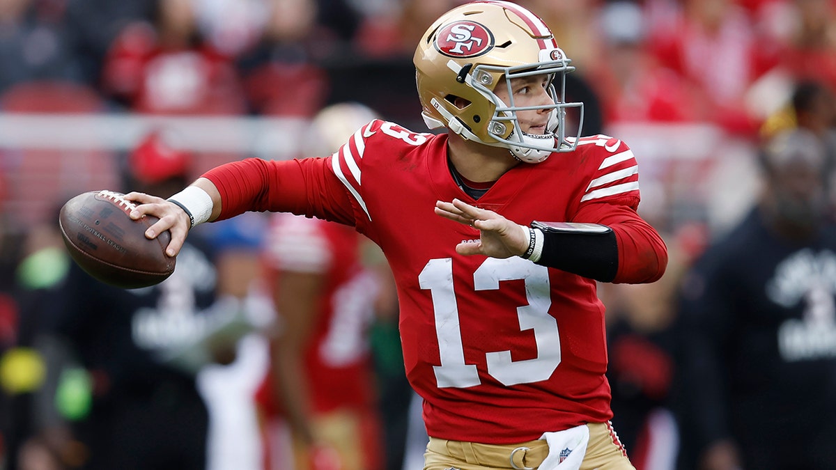 Brock Purdy throws a pass