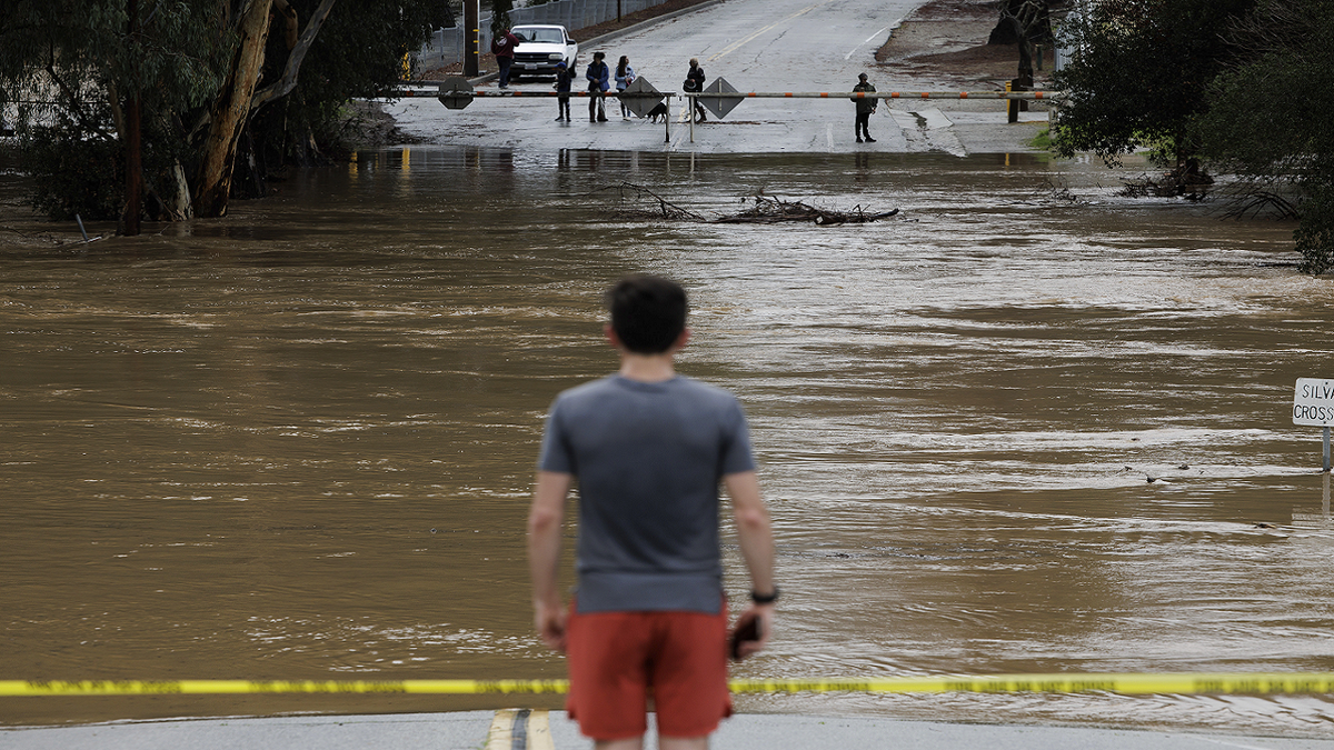 Uvas Creek floods a section of Miller Avenue in Gilroy, California, as the latest series of atmospheric rivers hit the Bay Area on Jan. 9, 2023.