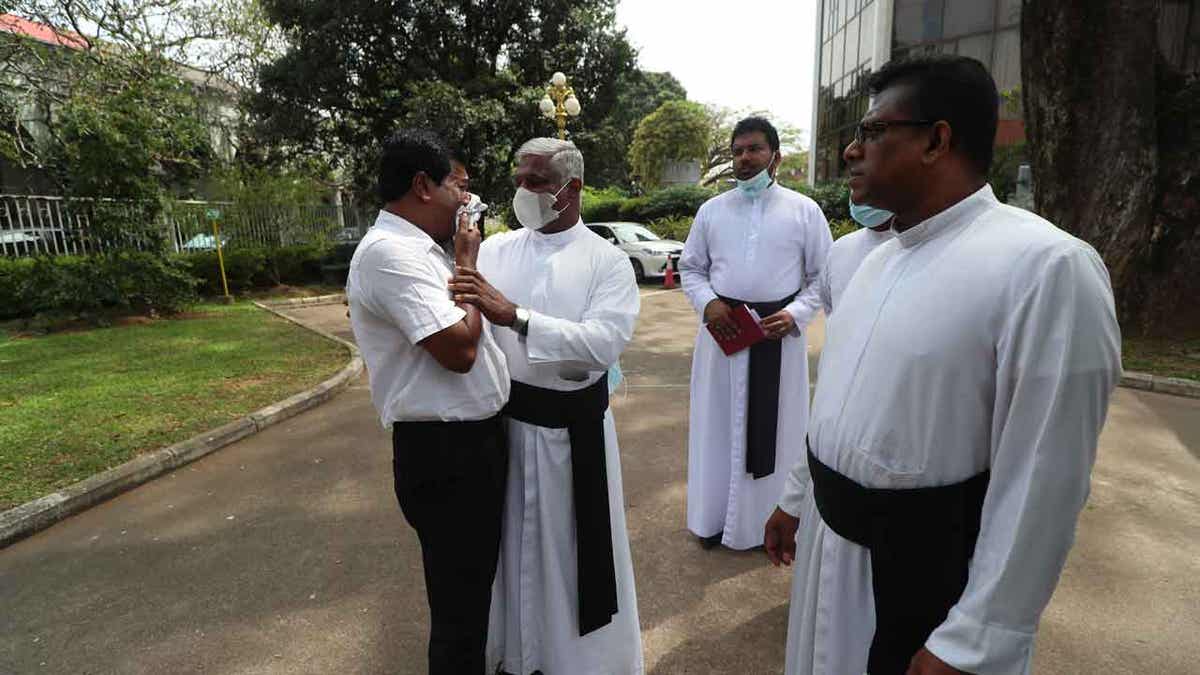 Priest in Sri Lanka consoles man