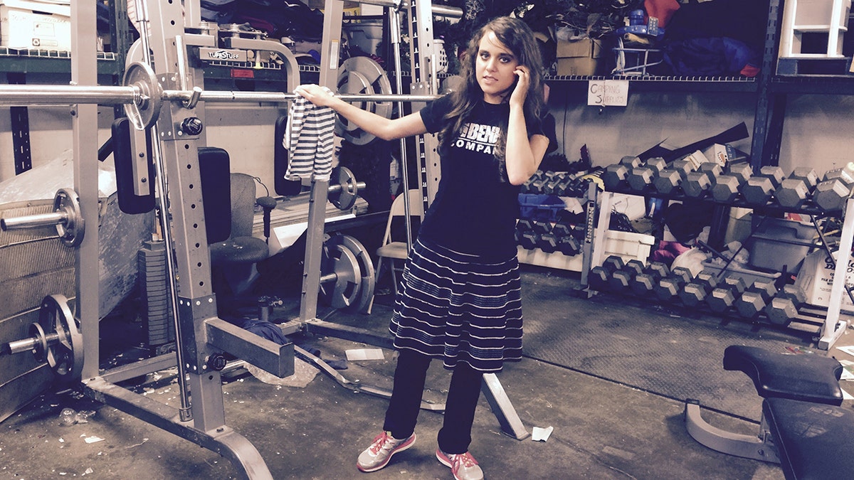 Jinger Duggar Vuolo wearing modest clothing while at a gym