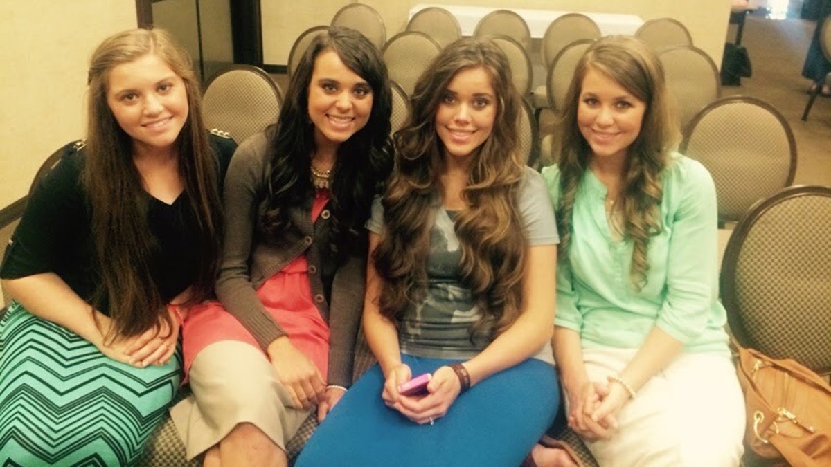 Jinger Duggar Vuolo smiling with two of her sisters.