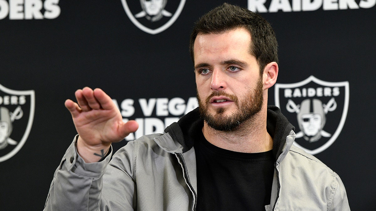 Derek Carr talks to reporters