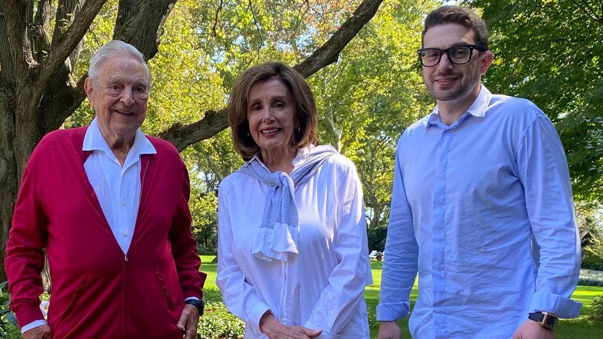 George Soros and his son, Alex, take picture with then-House Speaker Nancy Pelosi
