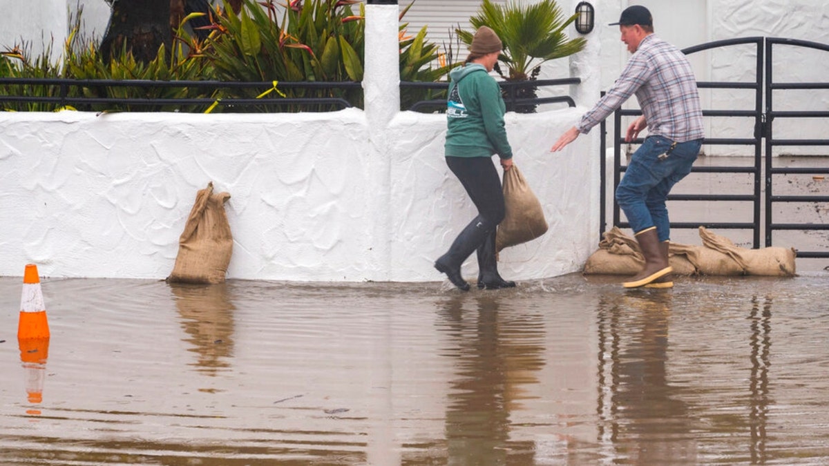 Sandbags are placed in front of a restaurant