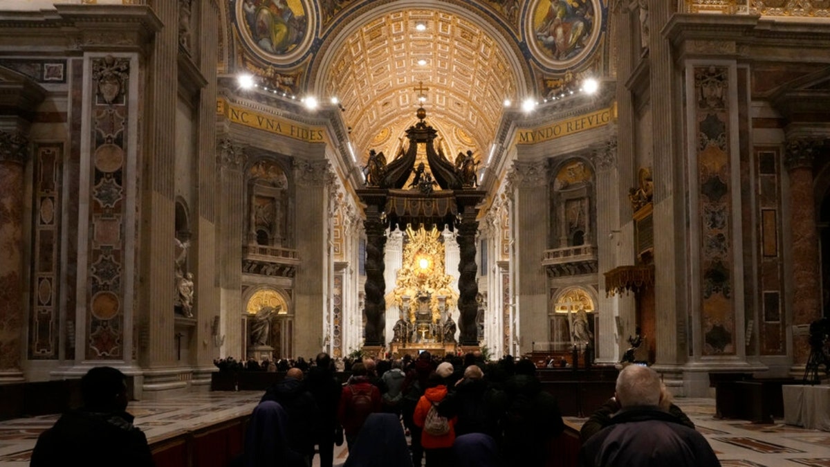 Mourners enter St. Peter's Basilica