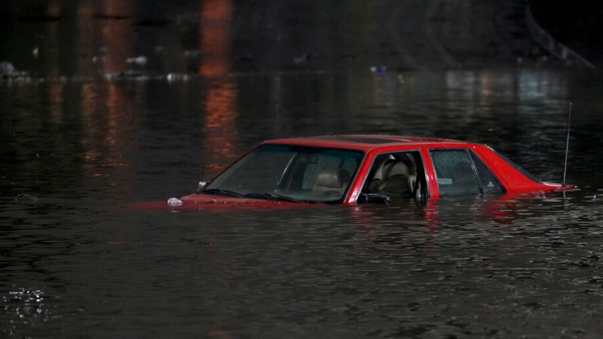 A vehicle and floodwaters in California
