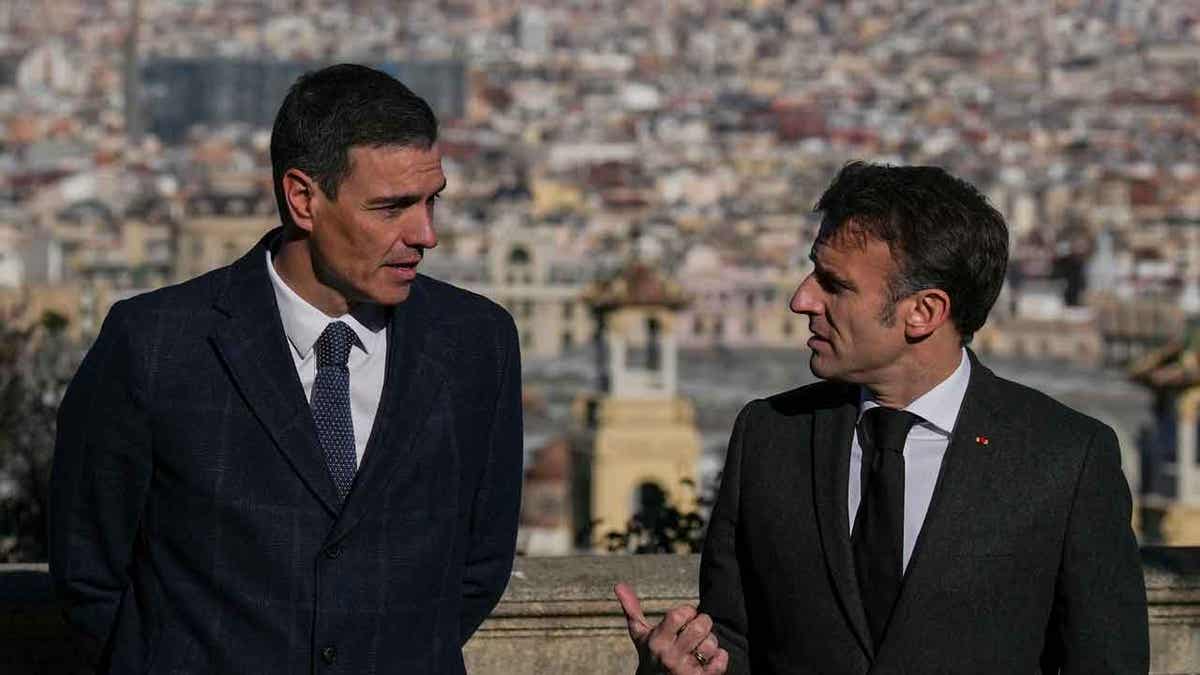 French President Emmanuel Macron, right, talks with Spanish counterpart Pedro Sánchez in Barcelona, Spain, on Jan. 19, 2023. The two leaders signed a friendship treaty on Thursday in Barcelona.