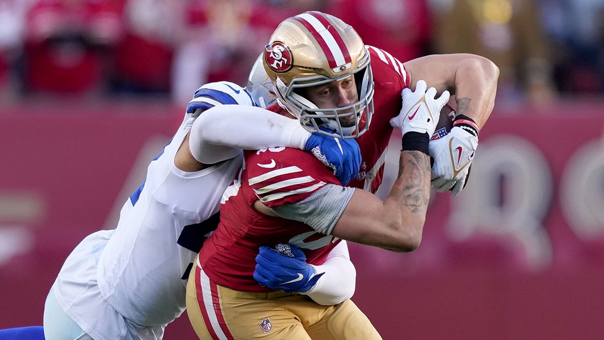 George Kittle is tackled