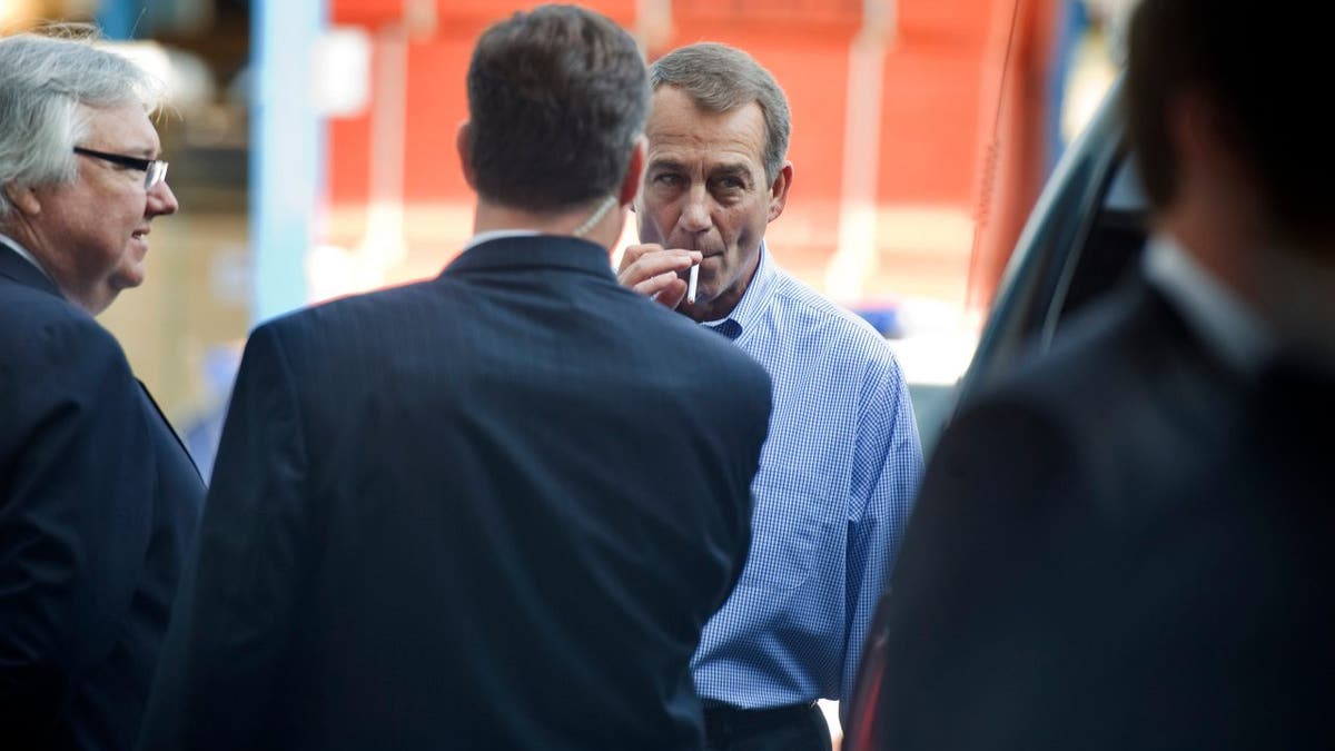 House Minority Leader John Boehner, R-Ohio, smokes a cigarette after a news conference outside of Tart Lumber Company in Sterling, Virginia, where they unveiled "A Pledge to America," a governing agenda devised by House Republicans for the 111th Congress.
