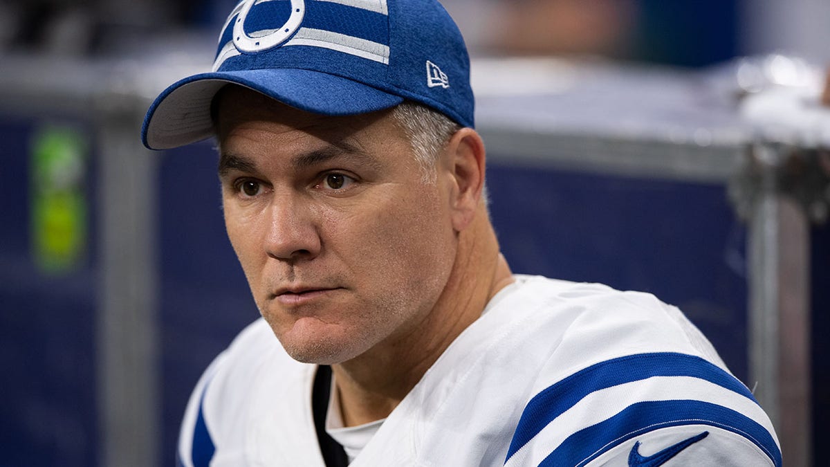 Adam Vinatieri sits on the sidelines against the Titans