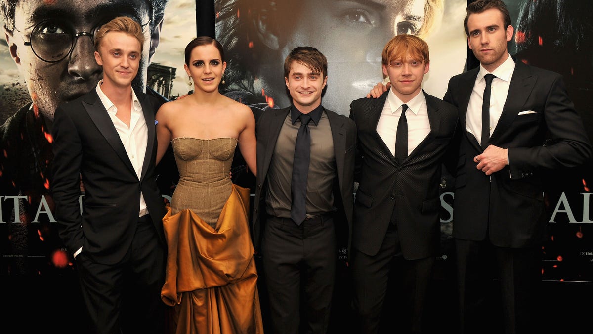 L to R: Tom Felton, Emma Watson, Daniel Radcliffe, Rupert Grint, and Matthew Lewis pose together for the premiere of Harry Potter and the Deathly Hallows Part 2 