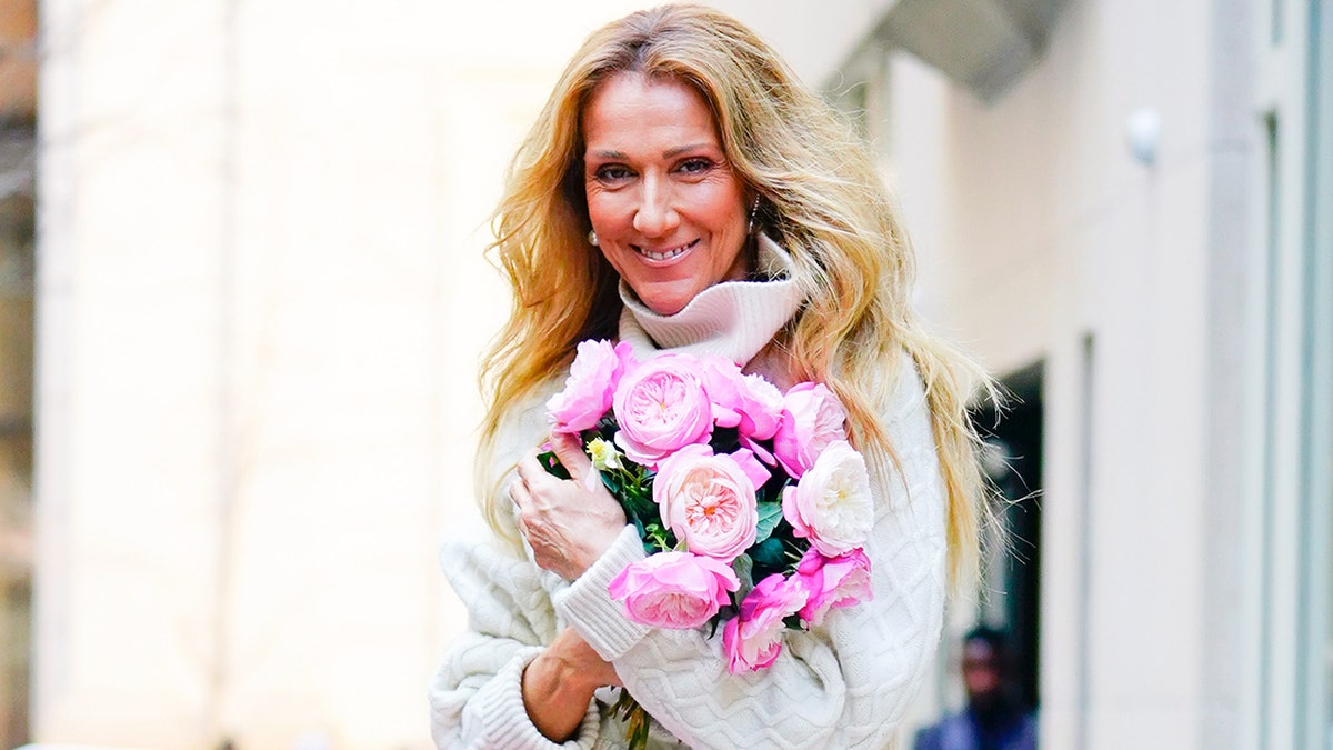 Celine Dion in New York holding flowers