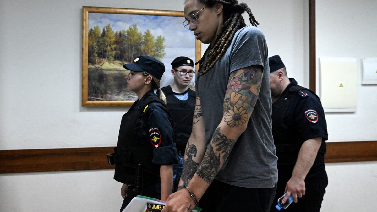 Brittney Griner walks in handcuffs