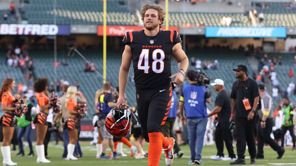 Bengals long snapper Cal Adomitis walks on the field