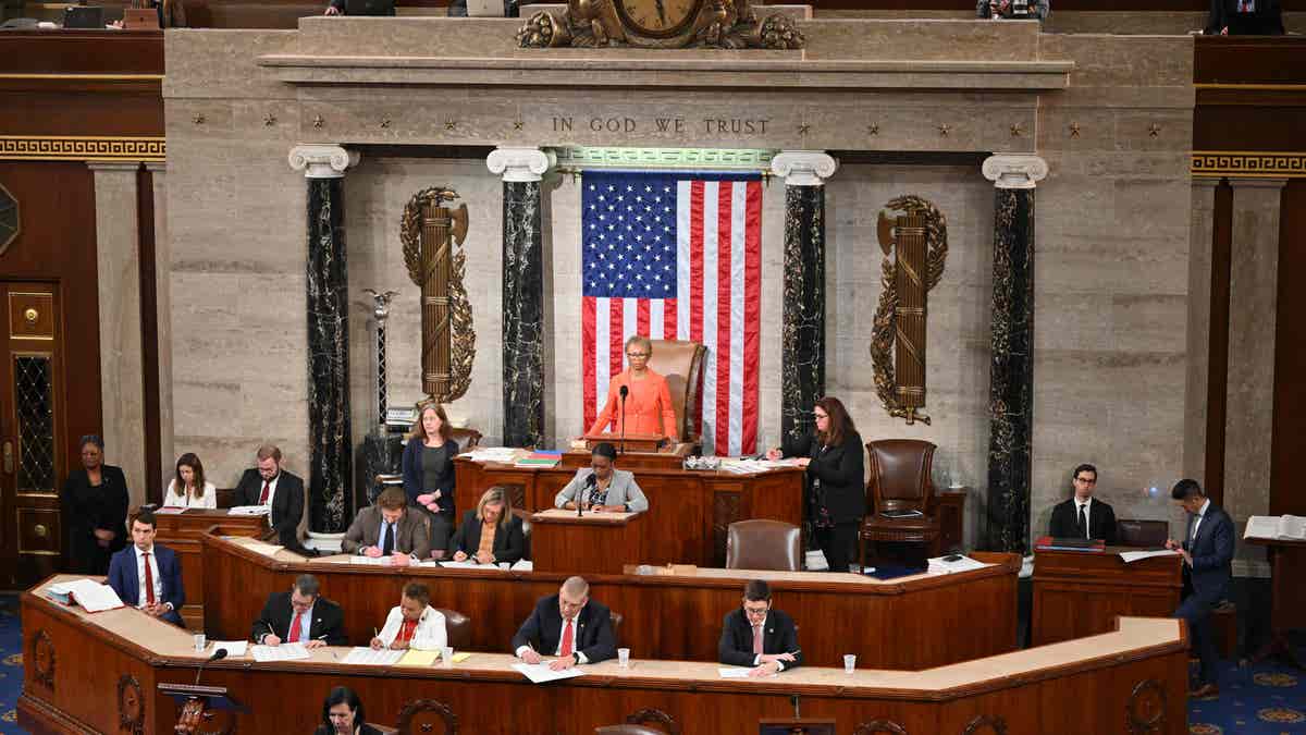 House Clerk Cheryl Johnson stands before House members