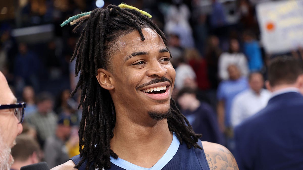 Ja Morant smiles after beating the Spurs