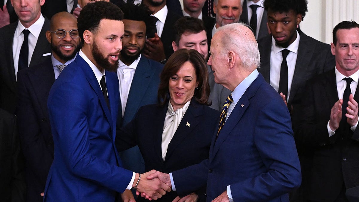 Golden State Warriors basketball player Stephen Curry shakes hands with Stephen Curry