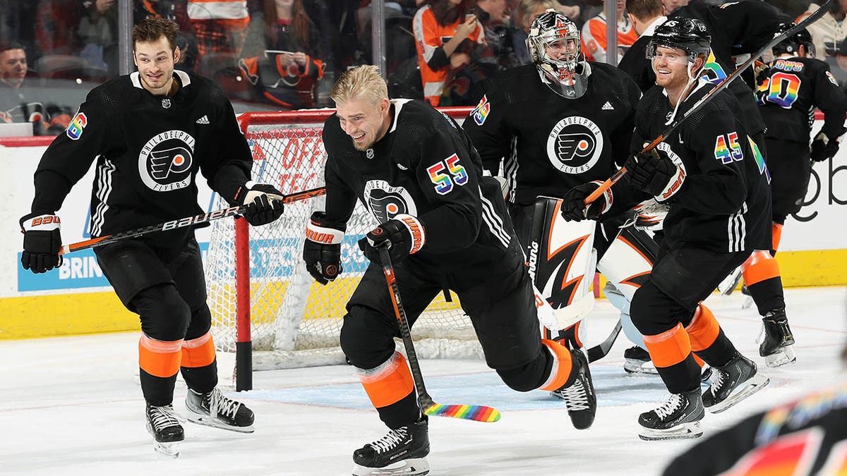 Flyers players skate during warmups