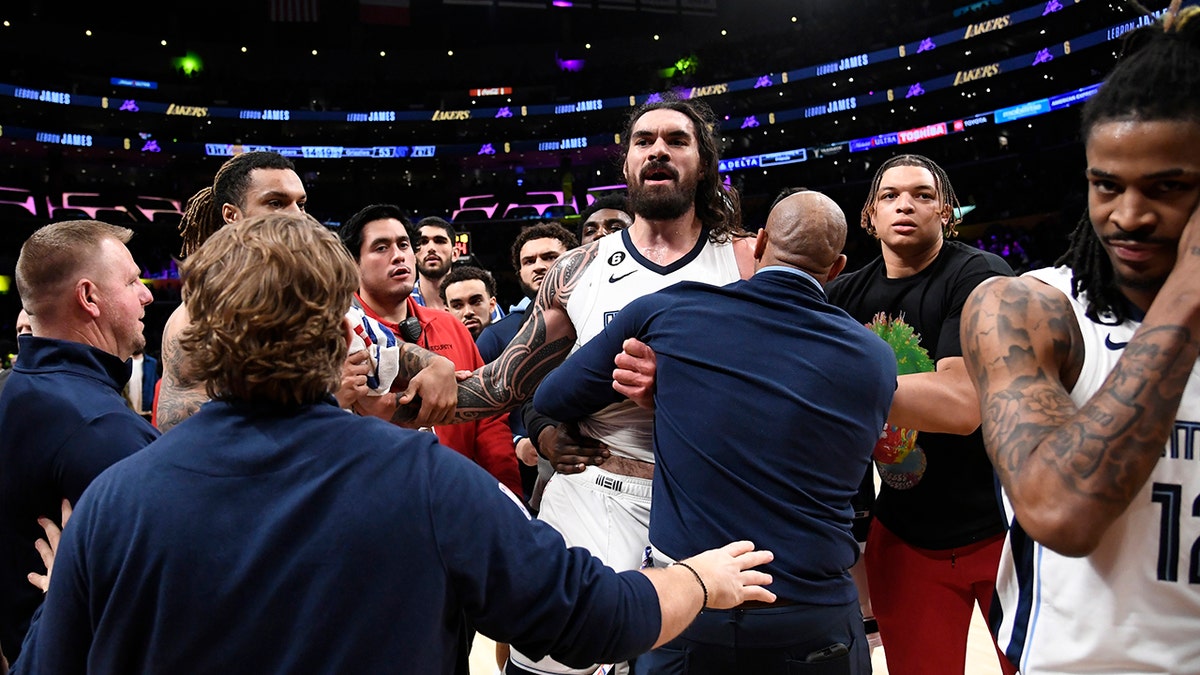 Steven Adams being held back