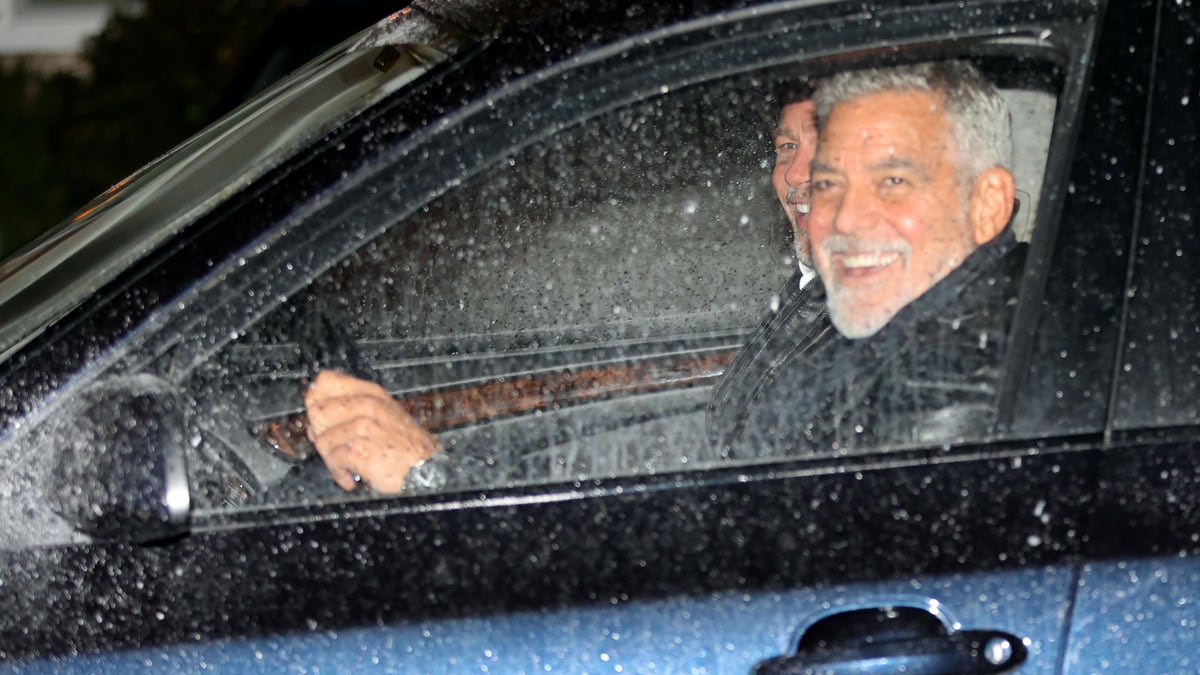 George Clooney Brad Pitt smiling in car