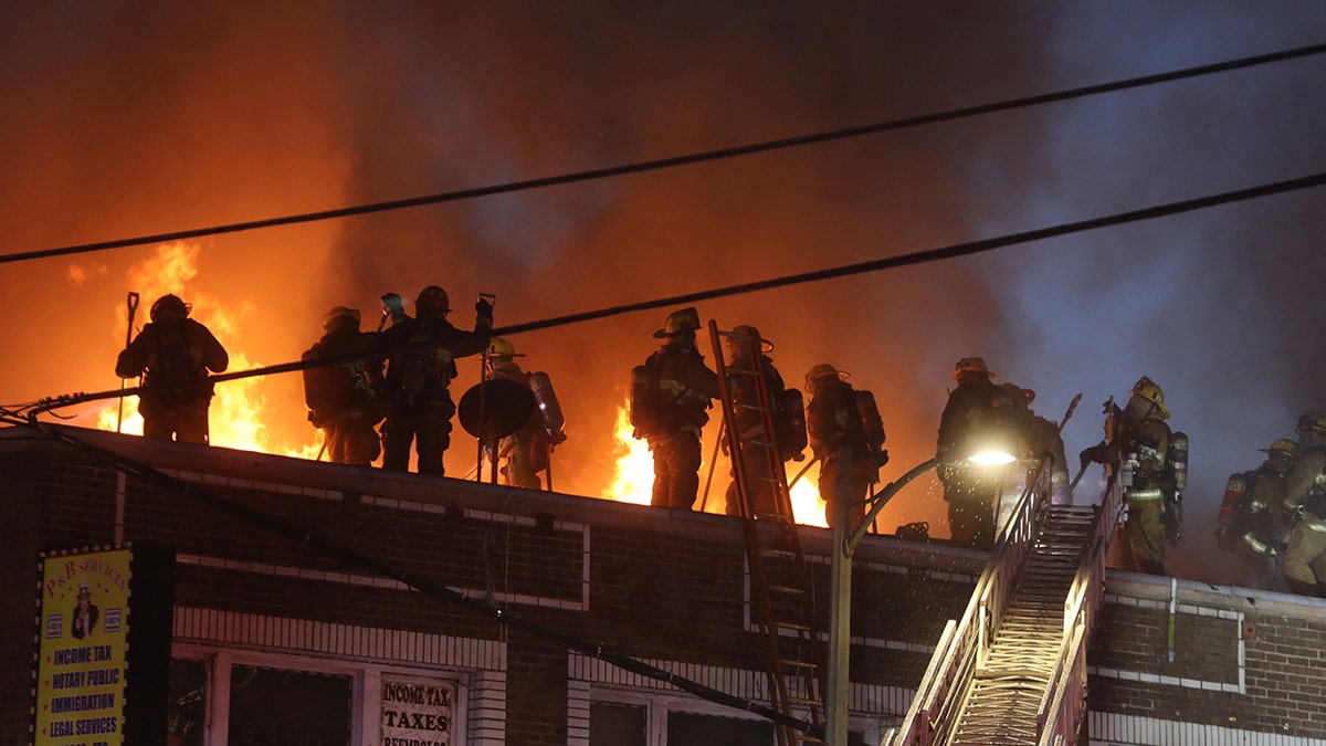 Firefighters on a roof