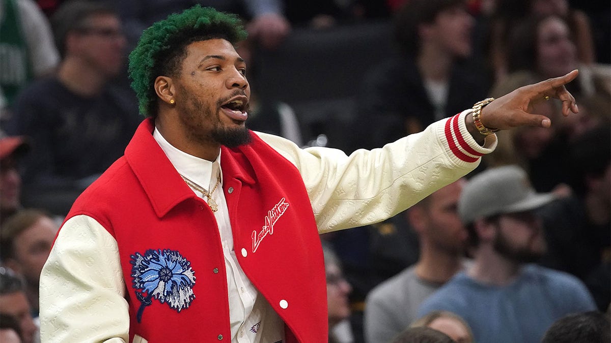 Marcus Smart watches the Celtics from the bench