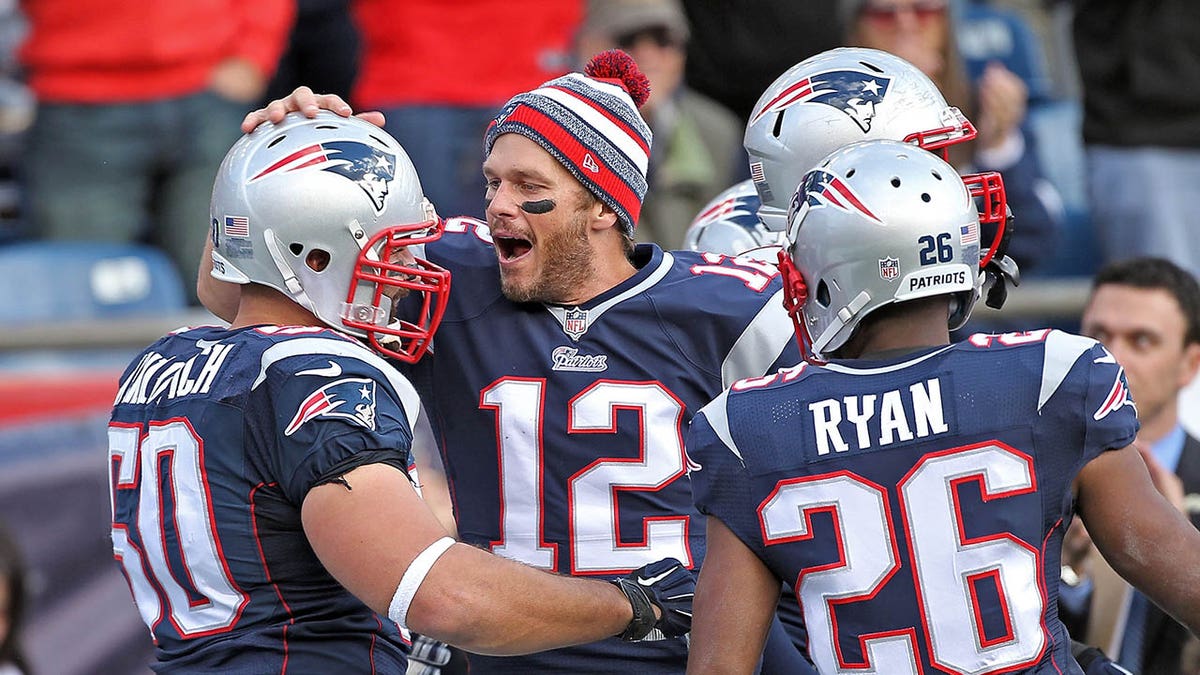 Tom Brady embraces Rob Ninkovich's fumble recovery