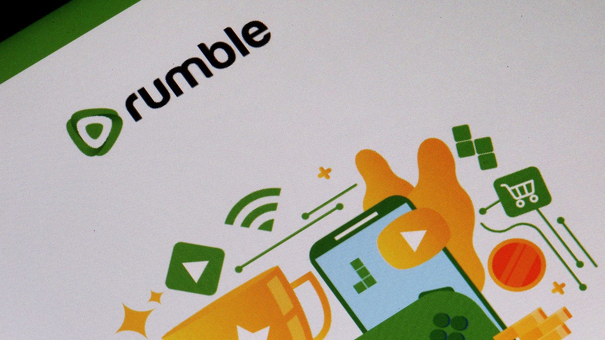 In this photo illustration, the logo of the social media Rumble is displayed on the screen of a tablet on January 12, 2021 in Paris, France. (Photo illustration by Chesnot/Getty Images)