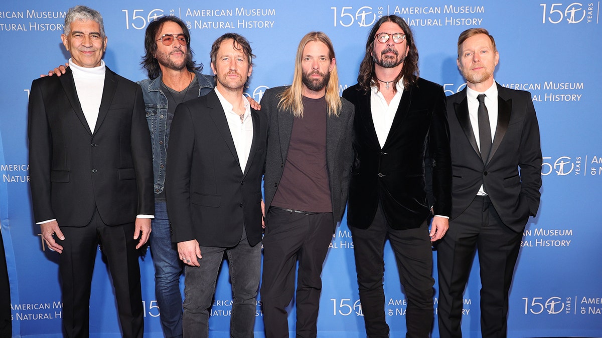 The Foo Fighters: Pat Smear, Rami Jaffee, Chris Shiflett, Taylor Hawkins, Dave Grohl and Nate Mendel in New York for the American Museum of Natural History Gala on the carpet