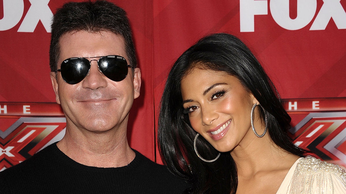 Simon Cowell and Nicole Scherzinger at X Factor press conference 